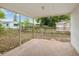 The covered back patio allows outdoor entertaining with a view of the fenced backyard at 9316 Whitman Ln, Port Richey, FL 34668