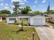 Charming single-story home with a well-manicured front yard and a convenient driveway at 9316 Whitman Ln, Port Richey, FL 34668