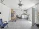 Spacious garage with washer, dryer, ladder, and storage space at 9316 Whitman Ln, Port Richey, FL 34668