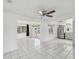 Bright, open living area features tile flooring and stainless steel appliances at 9316 Whitman Ln, Port Richey, FL 34668