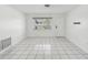 Bright, open living room with tile floors and a view to the front yard at 9316 Whitman Ln, Port Richey, FL 34668