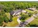 Aerial view showcasing the expansive property, mature trees, and private setting at 10110 Weeks Dr, Brooksville, FL 34601
