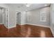 Bedroom featuring hardwood floors, a ceiling fan, and natural light from the dual windows at 10110 Weeks Dr, Brooksville, FL 34601
