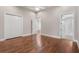Bedroom featuring hardwood floors, neutral walls, large closet, and ceiling fan at 10110 Weeks Dr, Brooksville, FL 34601
