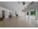 Spacious three-car garage with epoxy flooring, storage, and access to main house at 10110 Weeks Dr, Brooksville, FL 34601