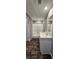 Bathroom showcasing a shower, vanity with white countertop, and wood-look flooring at 11304 Altoona Ave, New Port Richey, FL 34654