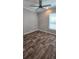 Bright bedroom has new luxury vinyl plank flooring and a ceiling fan at 11304 Altoona Ave, New Port Richey, FL 34654