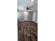 Comfortable bedroom features neutral walls and luxury vinyl plank flooring at 11304 Altoona Ave, New Port Richey, FL 34654