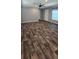 Spacious living room boasts luxury vinyl plank flooring and natural light at 11304 Altoona Ave, New Port Richey, FL 34654