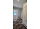 Mud room with wood-look flooring, ample storage, and access to the exterior at 11304 Altoona Ave, New Port Richey, FL 34654