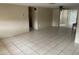 The living room features tile floors, neutral walls, and sliding glass doors at 11515 Meredith Ln, Port Richey, FL 34668