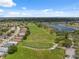 Scenic aerial view of the community, green spaces, and neighborhood homes at 11631 Wayside Willow Ct, Hudson, FL 34667