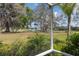 Scenic backyard view showcasing a pond with a fountain, providing a tranquil and picturesque setting at 11631 Wayside Willow Ct, Hudson, FL 34667