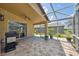 Beautiful enclosed patio with brick flooring, a ceiling fan, and a view of the backyard at 11631 Wayside Willow Ct, Hudson, FL 34667
