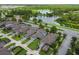 Aerial neighborhood view, showcasing backyard landscaping, lake, and nearby highway at 12272 Rangeland Blvd, Odessa, FL 33556