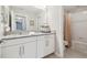 Bathroom featuring granite countertops, white cabinets, and a shower/bath combo at 12272 Rangeland Blvd, Odessa, FL 33556