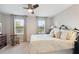 Comfortable bedroom with soft lighting, carpeted floors, and natural light at 12272 Rangeland Blvd, Odessa, FL 33556