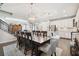 Spacious dining room showcases a large wooden table, seating for eight, and access to the kitchen and living areas at 12272 Rangeland Blvd, Odessa, FL 33556