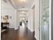Elegant foyer with gleaming hardwood floors and decorative glass front door, creating a grand entrance at 12272 Rangeland Blvd, Odessa, FL 33556