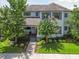 Attractive two-story home with a well-manicured lawn and mature landscaping, providing curb appeal at 12272 Rangeland Blvd, Odessa, FL 33556
