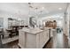 Spacious kitchen island with granite countertops and dining table views with adjacent dining and living spaces in an open floor plan at 12272 Rangeland Blvd, Odessa, FL 33556