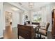 Bright office with hardwood floors, traditional wood desk, and chair at 12272 Rangeland Blvd, Odessa, FL 33556