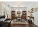 Bright office with hardwood floors, traditional wood desk, bookshelves, and area rug at 12272 Rangeland Blvd, Odessa, FL 33556
