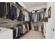 Spacious walk-in closet with ample storage, featuring organized shelving and hanging space for clothing and accessories at 12272 Rangeland Blvd, Odessa, FL 33556