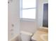 Bathroom featuring a toilet, shower and tub combo, and vanity with a mirror at 12431 White Bluff Rd, Hudson, FL 34669