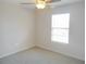 Bedroom featuring a ceiling fan, window, and neutral carpet flooring at 12431 White Bluff Rd, Hudson, FL 34669