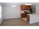 Well-lit kitchen open to the dining area, featuring stainless steel appliances and brown cabinetry at 12431 White Bluff Rd, Hudson, FL 34669