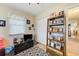 Bright bedroom with a closet, shelving, and an adjacent hallway leading to other areas at 12478 Prescott St, Spring Hill, FL 34609