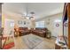 Bright living room featuring a cozy leather sofa and lots of natural light at 12478 Prescott St, Spring Hill, FL 34609