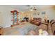 Cozy living room featuring hardwood floors, comfortable seating, and natural lighting at 12478 Prescott St, Spring Hill, FL 34609
