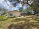 A well-maintained backyard with a private screened pool at 1280 Thornton Ct, Spring Hill, FL 34608