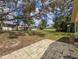 Expansive backyard with mature trees and greenery, providing a tranquil outdoor space at 1280 Thornton Ct, Spring Hill, FL 34608
