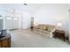 Cozy living room with a sofa, side tables, and white walls, creating a bright and inviting space at 1280 Thornton Ct, Spring Hill, FL 34608