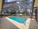 Private screened pool with ample patio space to enjoy the Florida weather at 1280 Thornton Ct, Spring Hill, FL 34608