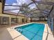 The screened-in pool is perfect for staying cool and comfortable in the Florida heat at 1280 Thornton Ct, Spring Hill, FL 34608