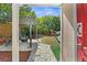 Inviting backyard featuring a pergola, fire pit, hammock, and lush landscaping offering a relaxing outdoor space at 1309 45Th S St, St Petersburg, FL 33711