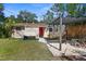 Charming backyard with a hammock, pergola, and outdoor seating area, creating a cozy and inviting retreat at 1309 45Th S St, St Petersburg, FL 33711