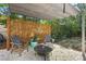 Inviting backyard patio with stone ground, a fire pit, pergola, perfect for outdoor relaxation and entertaining at 1309 45Th S St, St Petersburg, FL 33711