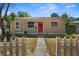 Charming home with a well-maintained front yard and a welcoming entrance, showcasing curb appeal and character at 1309 45Th S St, St Petersburg, FL 33711