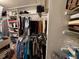 Walk-in closet features shelving, storage, and rod for hanging clothing at 1412 Linstock Dr, Holiday, FL 34690