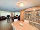 Open-concept dining room and living room with ample natural light and elegant decor at 1412 Linstock Dr, Holiday, FL 34690