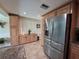 Bright kitchen with lots of cabinet storage and a stainless steel french door refrigerator at 1412 Linstock Dr, Holiday, FL 34690