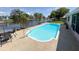 Refreshing pool area overlooking the canal, perfect for outdoor relaxation and waterfront enjoyment at 1412 Linstock Dr, Holiday, FL 34690