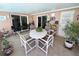 Enclosed sunroom offers comfortable seating and is perfect for entertaining guests or enjoying time at home at 1412 Linstock Dr, Holiday, FL 34690