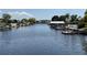 Scenic waterfront view with docks, houses, and clear skies at 1412 Linstock Dr, Holiday, FL 34690