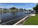 Beautiful waterfront view with docks, houses, and clear skies at 1412 Linstock Dr, Holiday, FL 34690